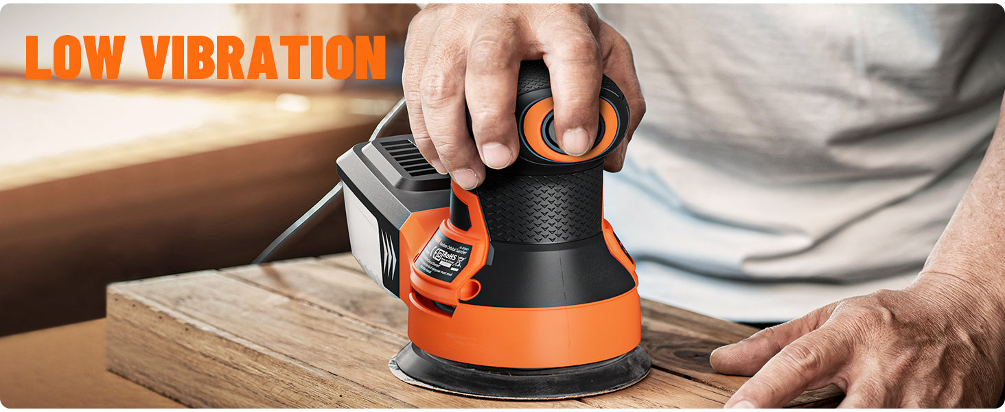 Person using a black and orange power sander on a wooden surface with 'Low Vibration' text.
