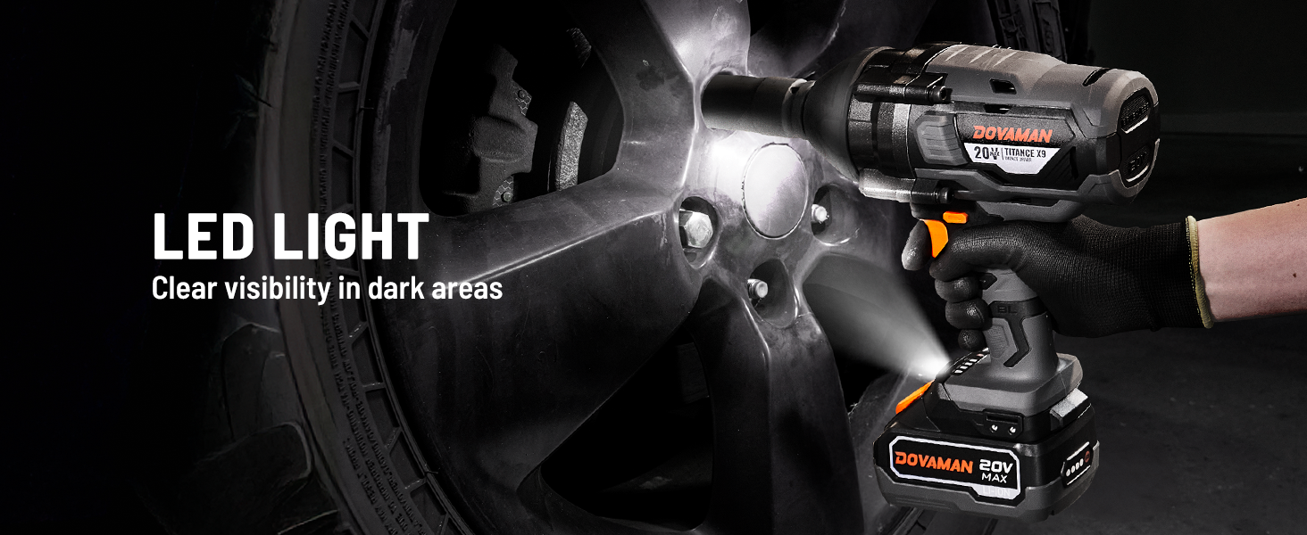 DOVAMAN impact wrench with LED light illuminating a wheel in dark conditions