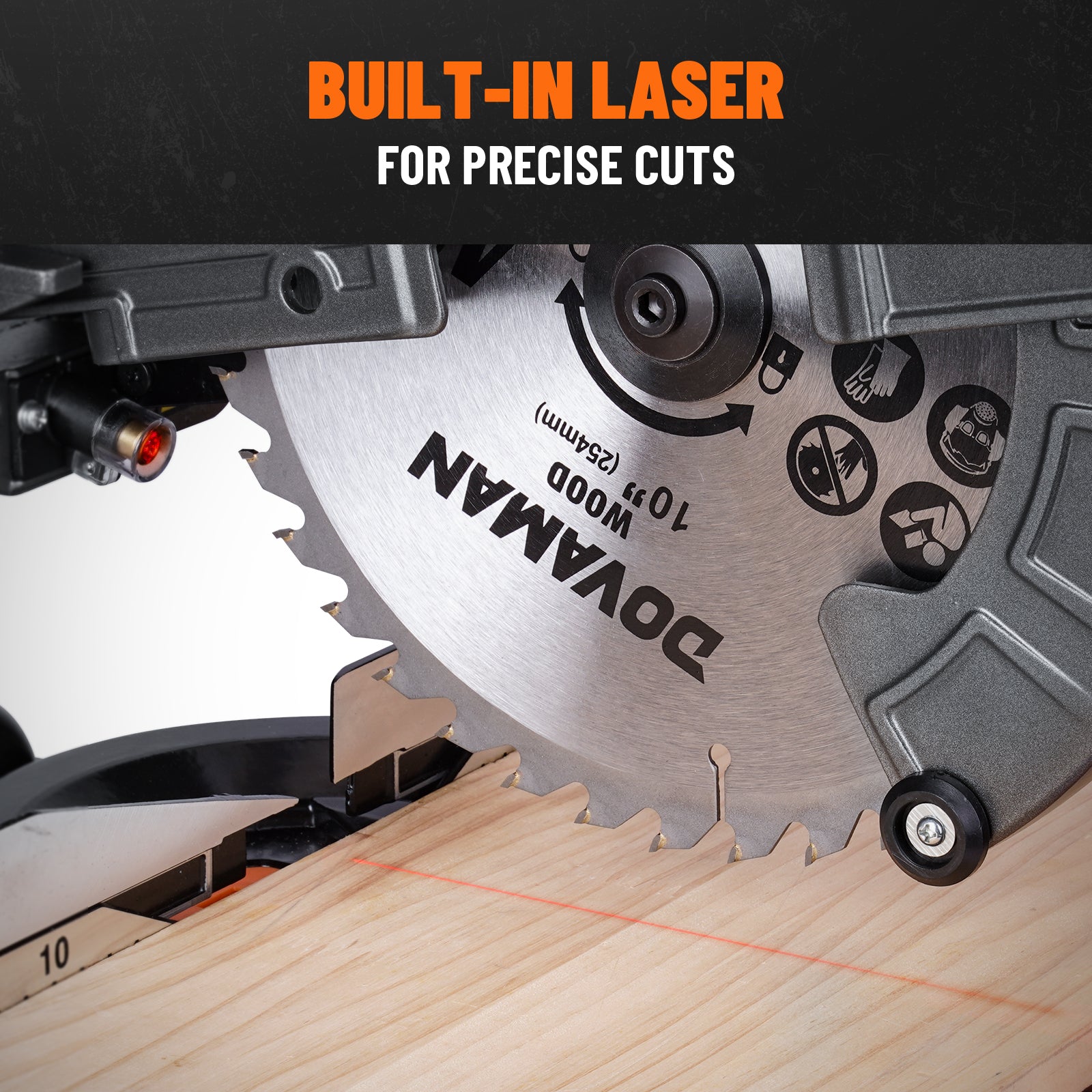 A red built-in laser guide on a 10-inch compound miter saw blade projecting a precise cutting line onto a wood board