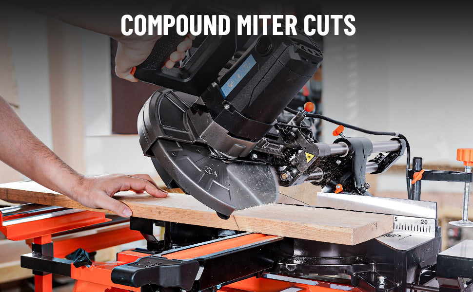Compound miter saw cutting wood with a person's hand guiding the material.