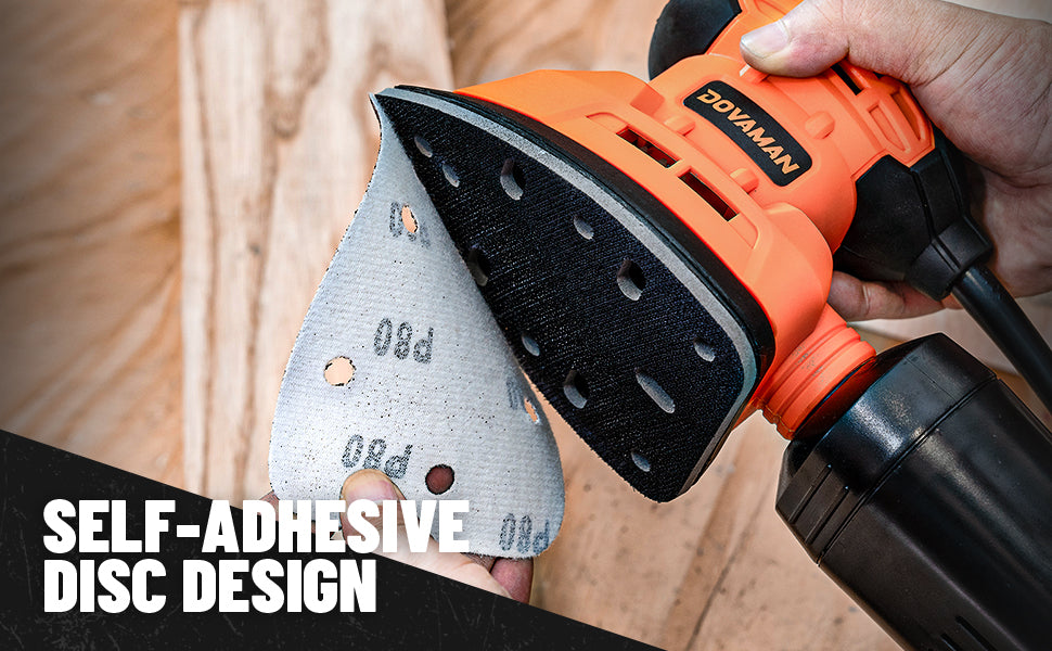 Sander with self-adhesive disc design held by a hand, with wooden background