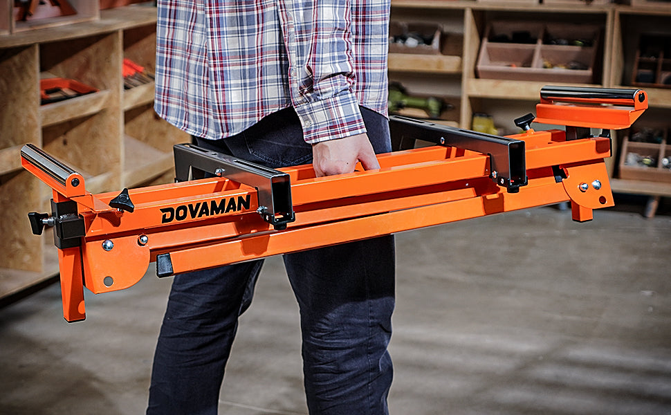 Person holding an orange Dovaman tool in a workshop setting
