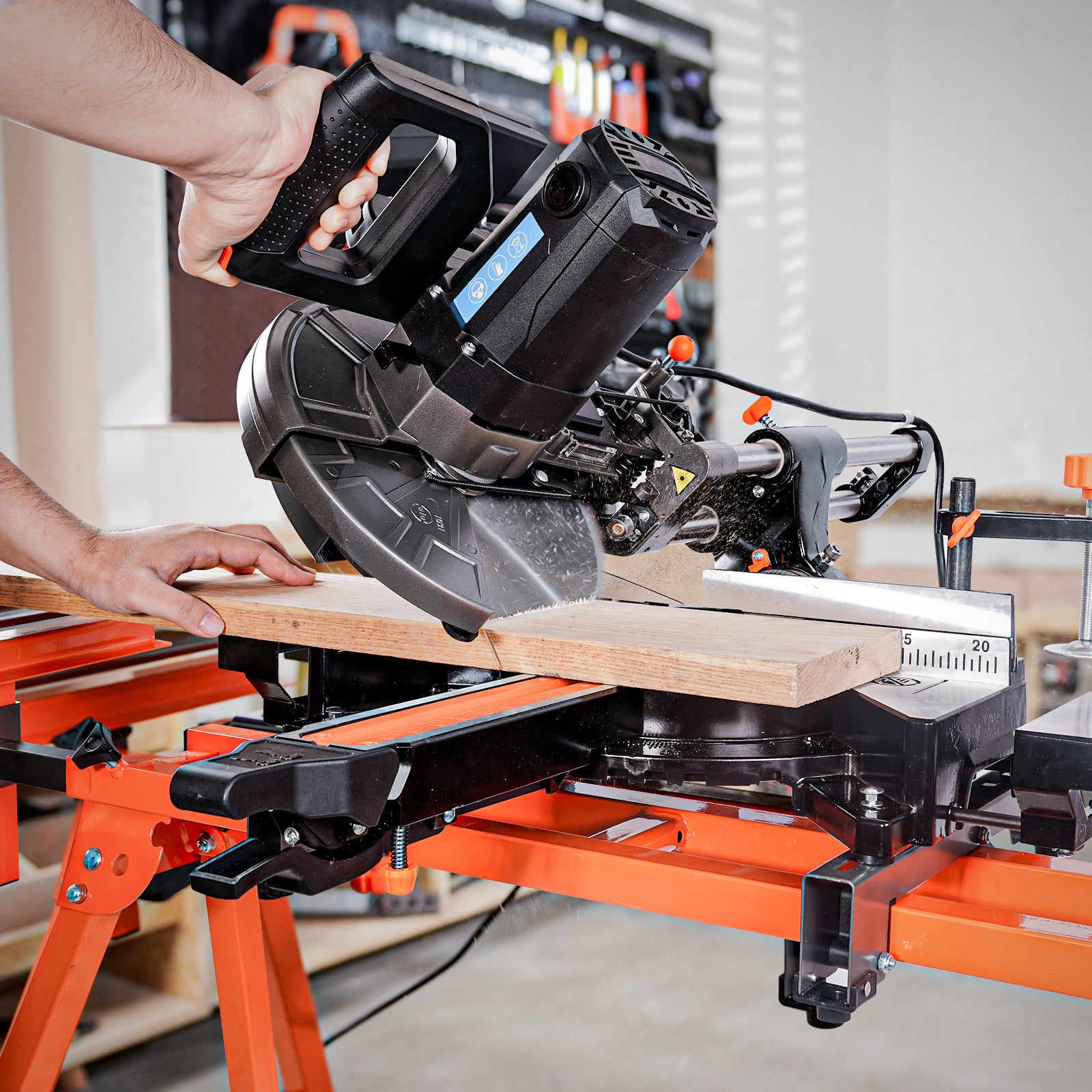 Person using a sliding miter saw to cut wood with an angle in a workshop setting                                                            